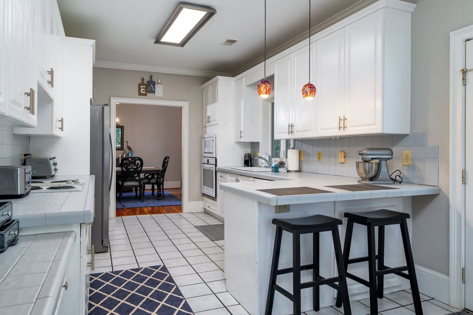 The kitchen sits just off the dining room and offers counter seating for two