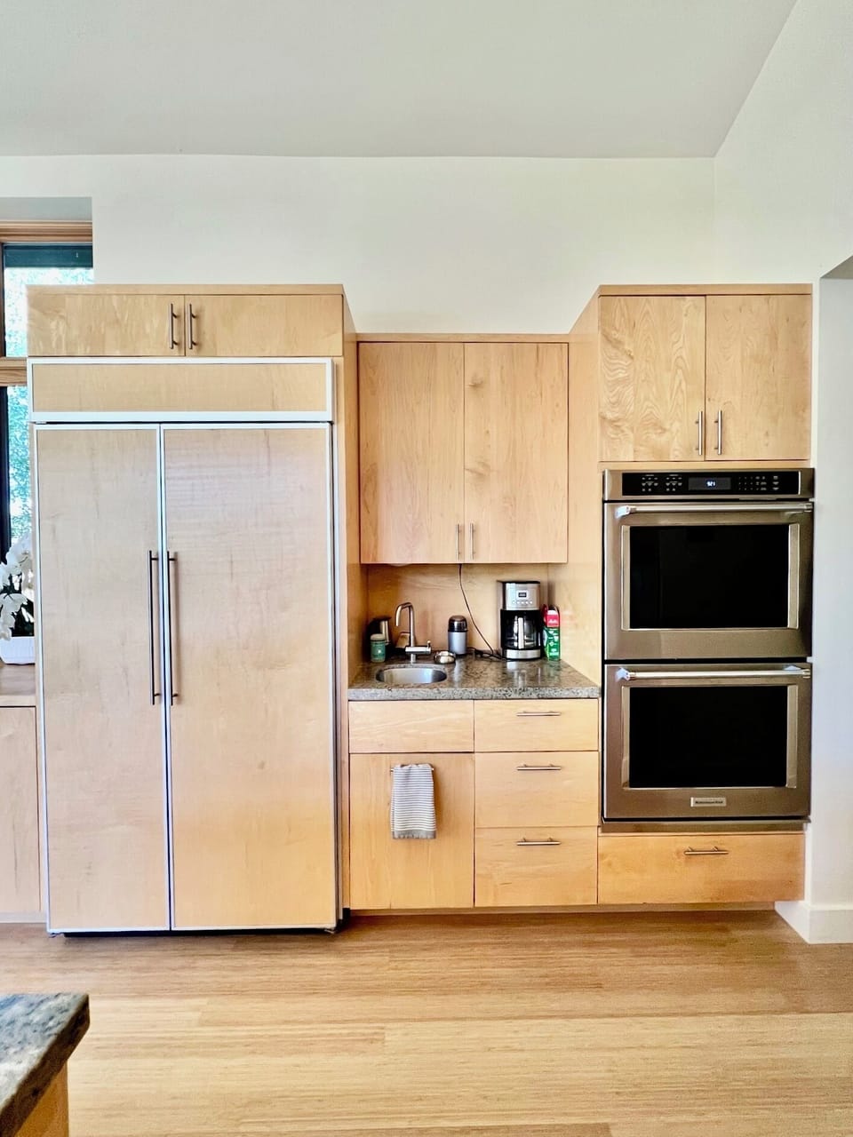 Double Thermador ovens and bar sink / coffee station. 