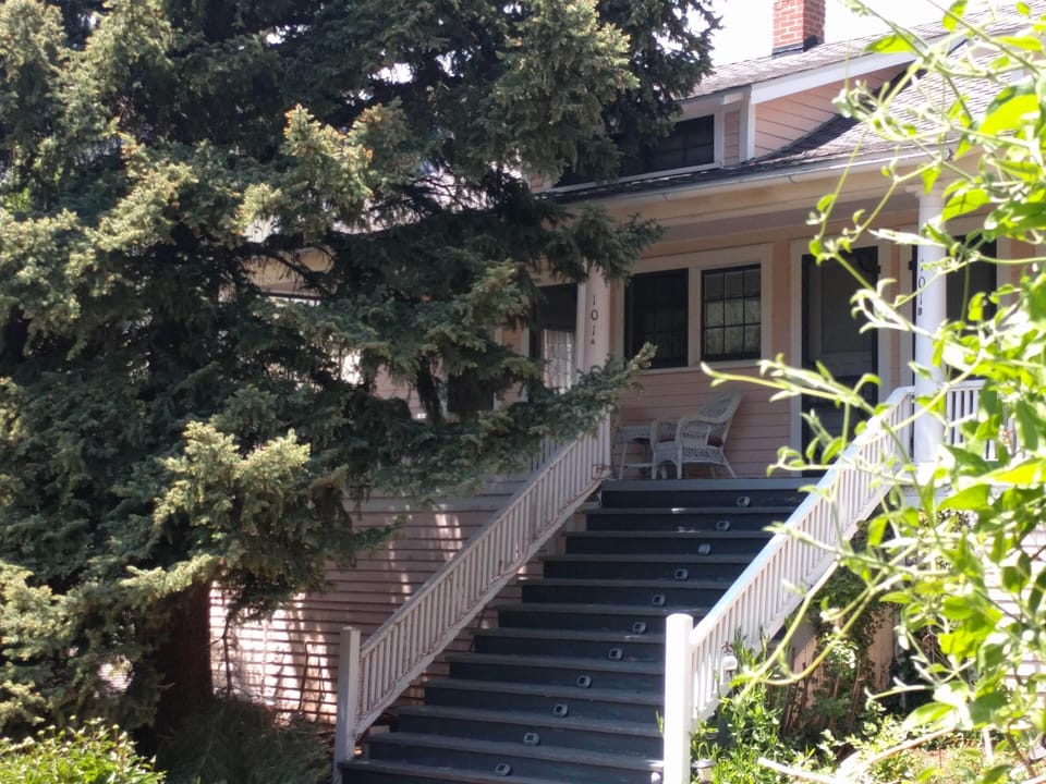 Great covered porch, with swing to relax and read a book! Honeysuckle=Hummers