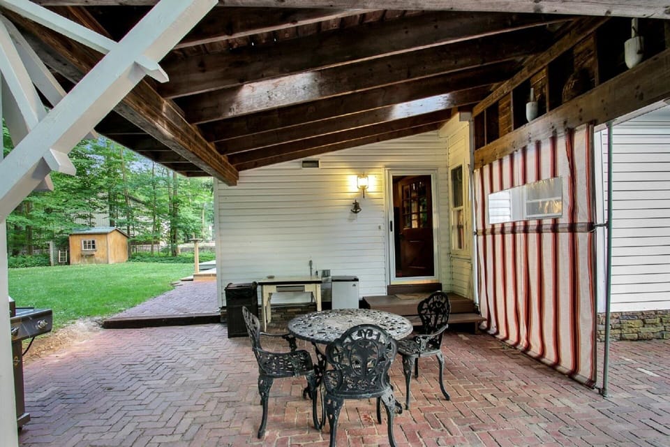 Side patio with a lake view/grill available