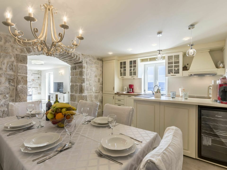 Table, Furniture, Property, Cabinetry, Tableware, Dishware, Lighting, Interior Design, Architecture