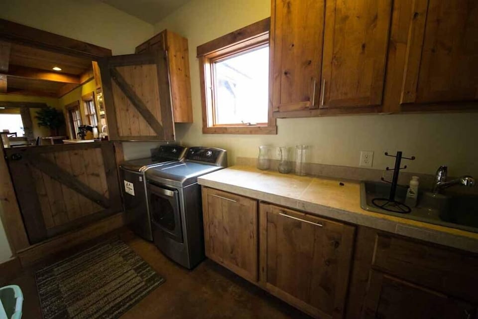 Laundry room with 2012 top of the line LG machines. Dryer has steam.