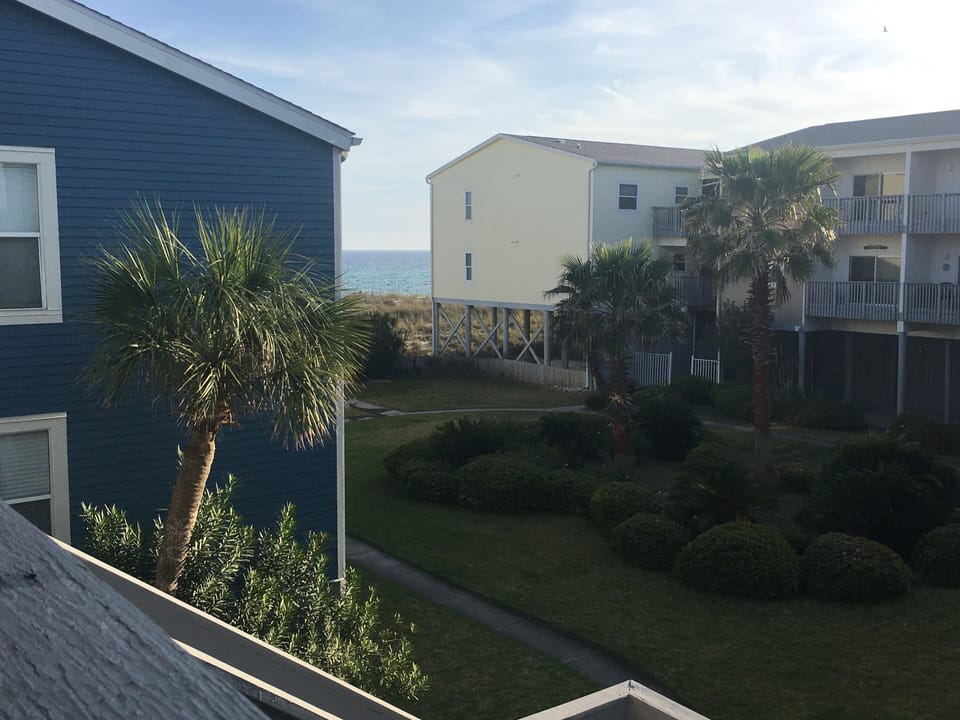 Courtyard off the balcony, leads directly to the beach.