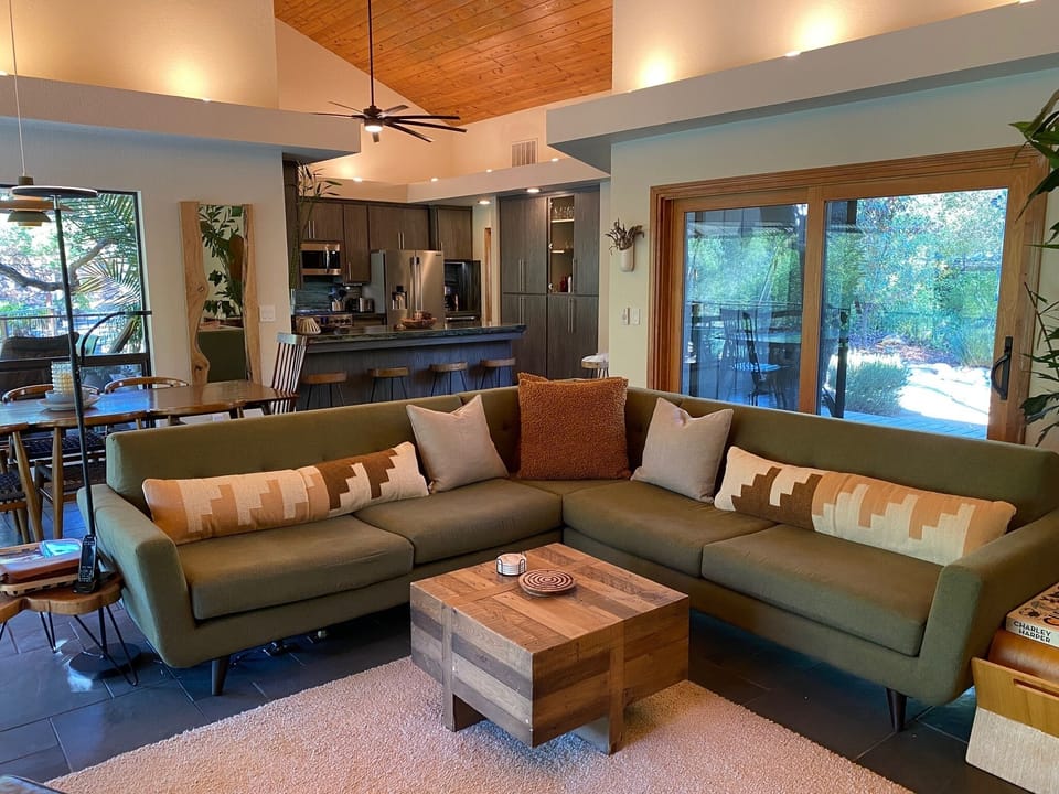 Living room with updated kitchen cabinets in 2022.   