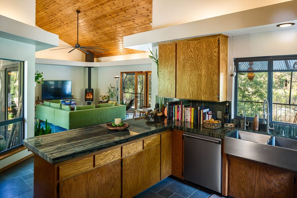 Main house kitchen/view of living room.