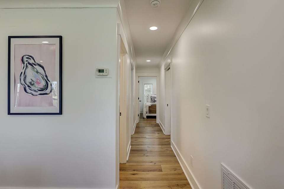 Hallway off family room to bathroom #3 on left, Laundry room & 2 more bedrooms