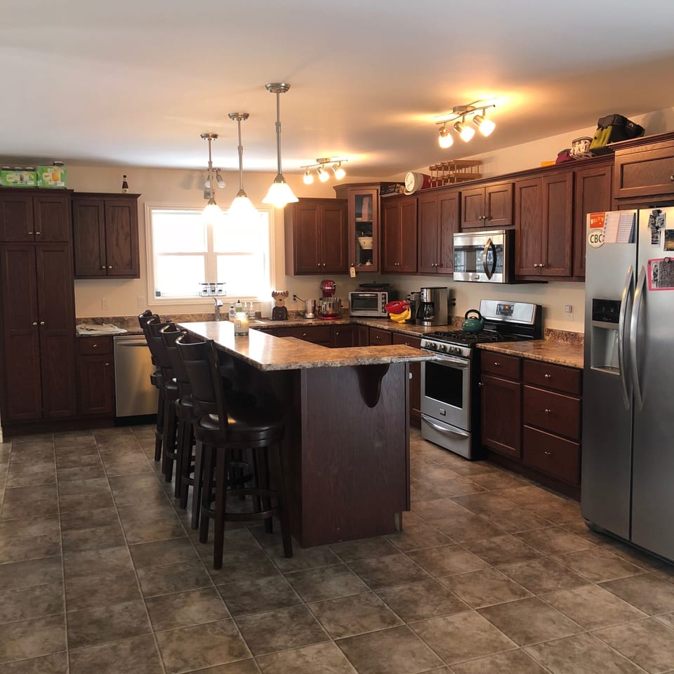huge open kitchen - with island that sits four on Raised level