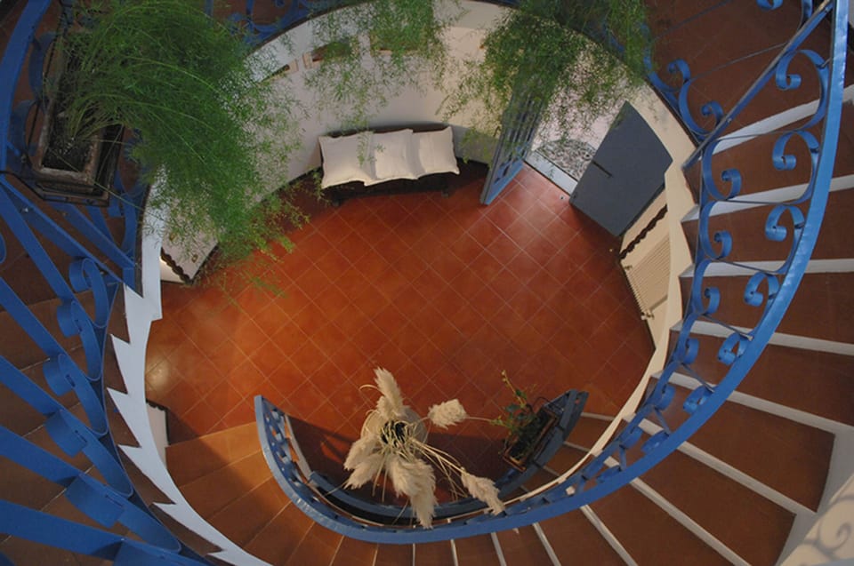 The main entry and the spiral  staircase looking down towards the entry door. 