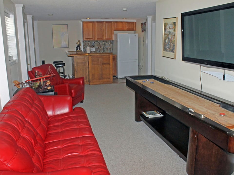 Lower level wet bar, refrig, coffee maker, microwave, blender nearby den/TV area