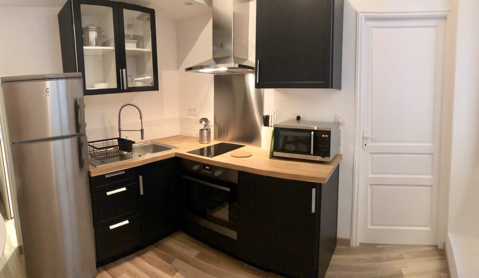 The kitchen has utensils, cookware and serving ware.  Nespresso in the cabinet!