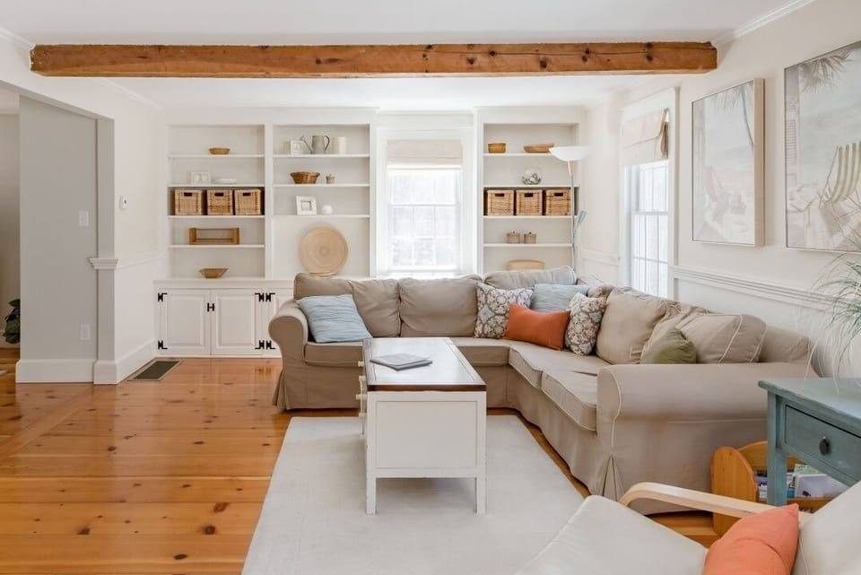 Family Room with Large Sectional Opens up into Dining Room