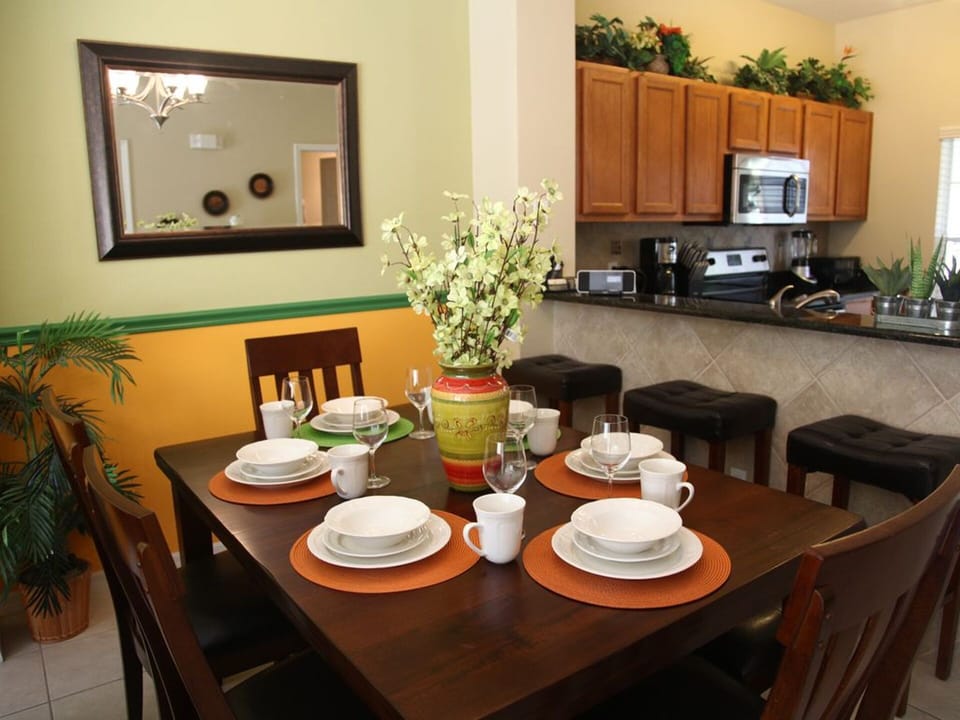 Dining area seats 6 and kitchen bar seats 3