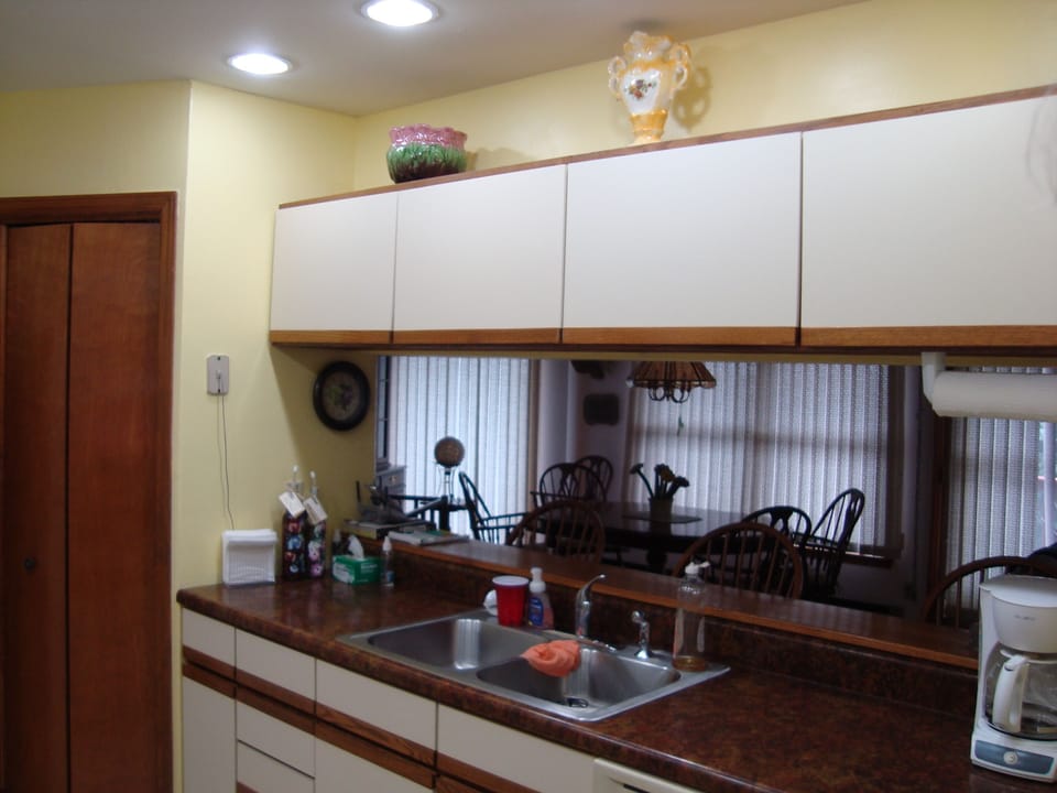 Complete Galley kitchen with all glassware and coffee bean grinder.