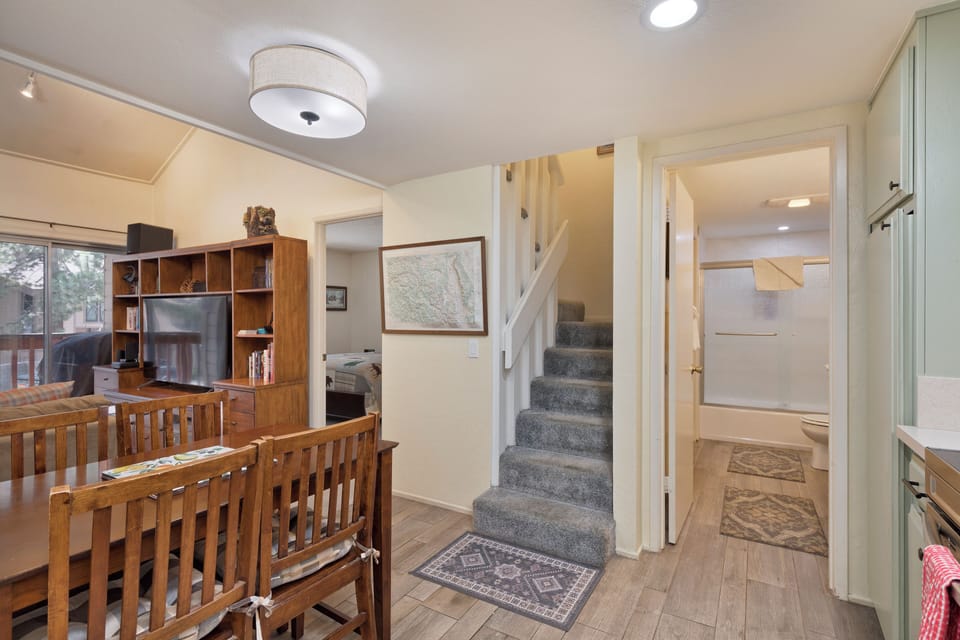Stairs to top level bedroom and another full bathroom