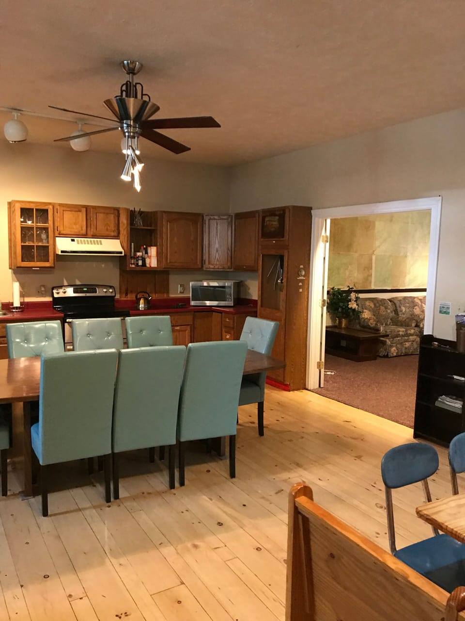 Spacious kitchen/dining area with 2 ovens and 9 burners to cook with. 2 fridges.