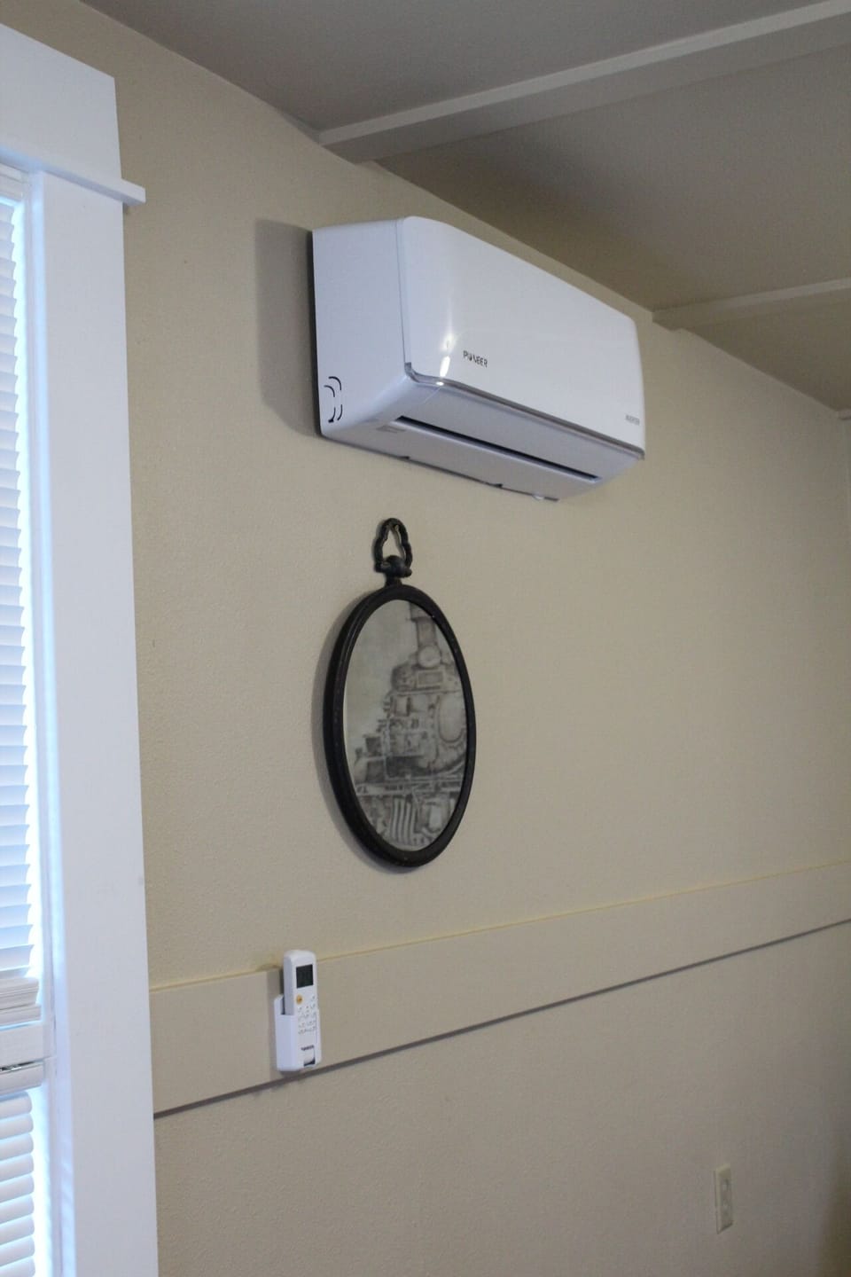 The heater/AC with remote. The other heater in the kitchen.