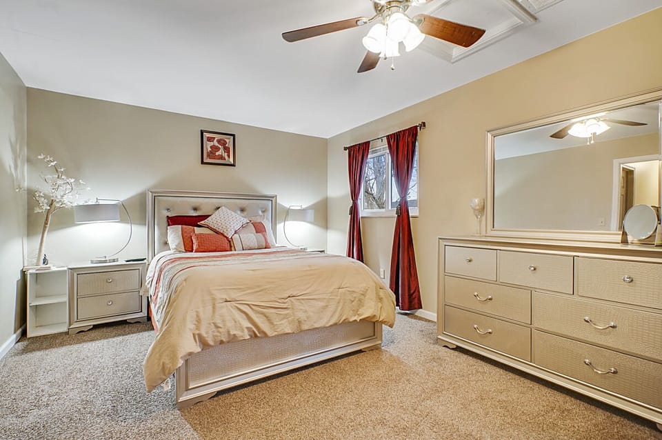 Huge size master bedroom with new queen sized bed, double night stands, 2 table lamps, new cute  comforter, additional quilt and blanket, new big LED Samsung TV, Bluetooth music player, chest, dresser with mirror, chair, walk-in closet, safe, weight scale, ceiling light and fan and decorative light