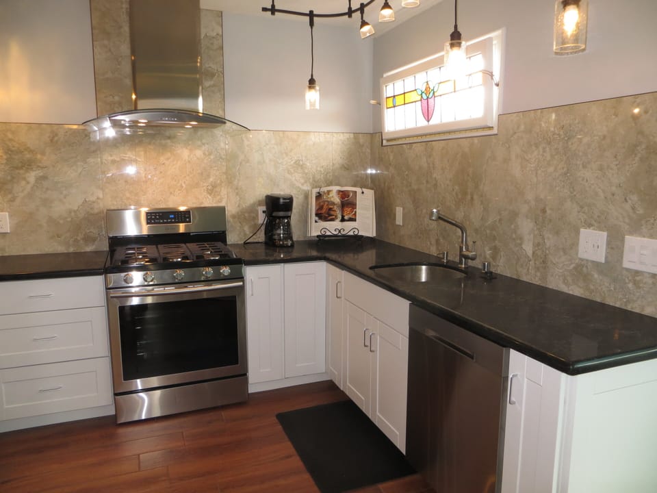 Kitchen featuring 5 burner stove and deep sink