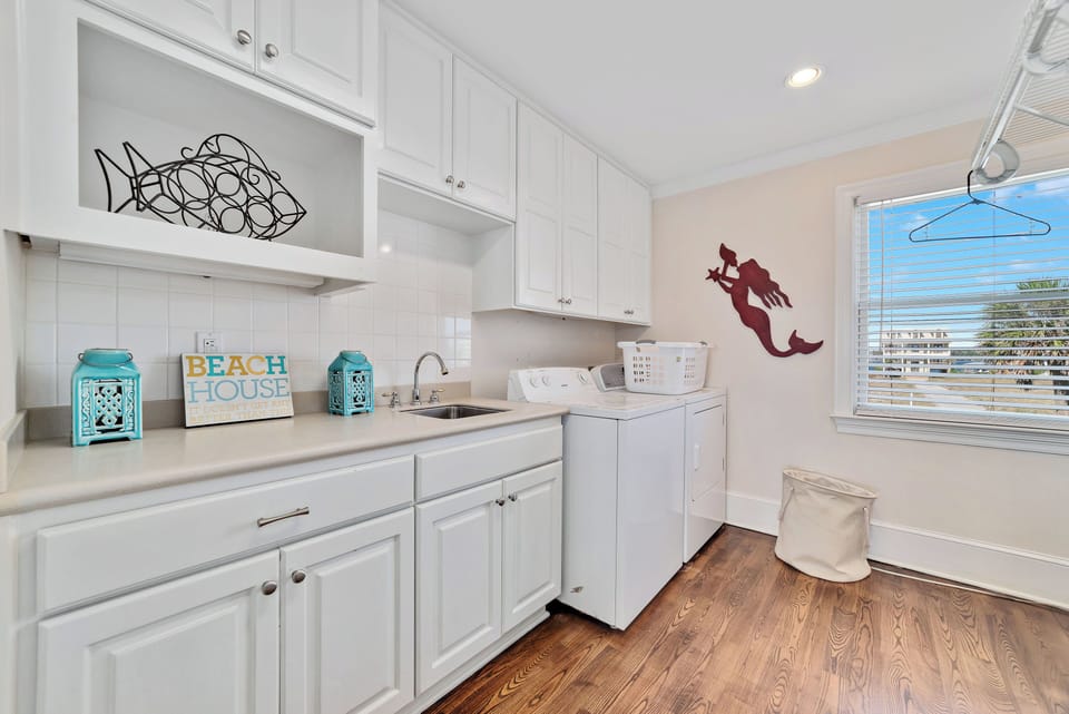 Laundry room with an extra fridge