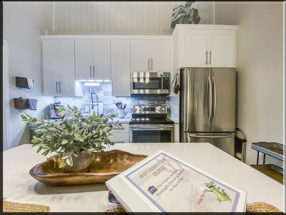 Smart kitchen design containing full size appliances and kitchen equipment.
