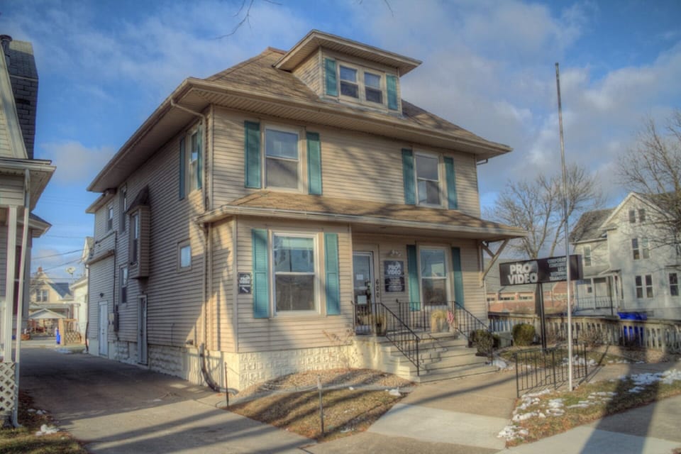 Street view, private entrance on side of building to 2nd floor unit.