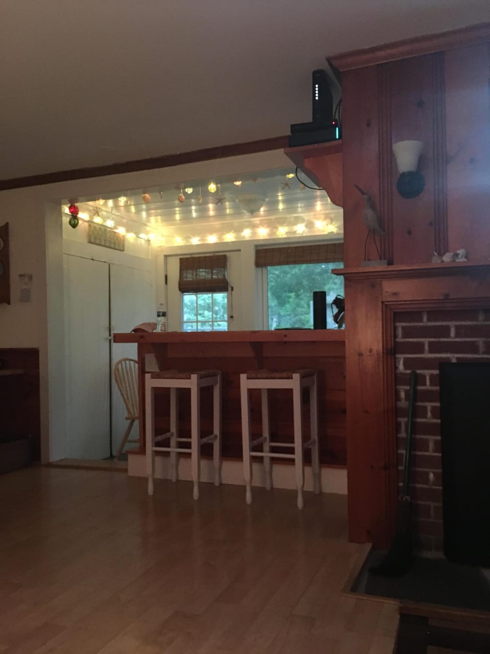 Breakfast Bar looking out to sun room and yard