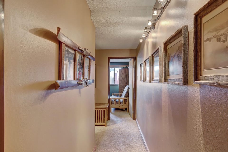 Upstairs Hallway between Bedrooms with historic Breckenridge photos