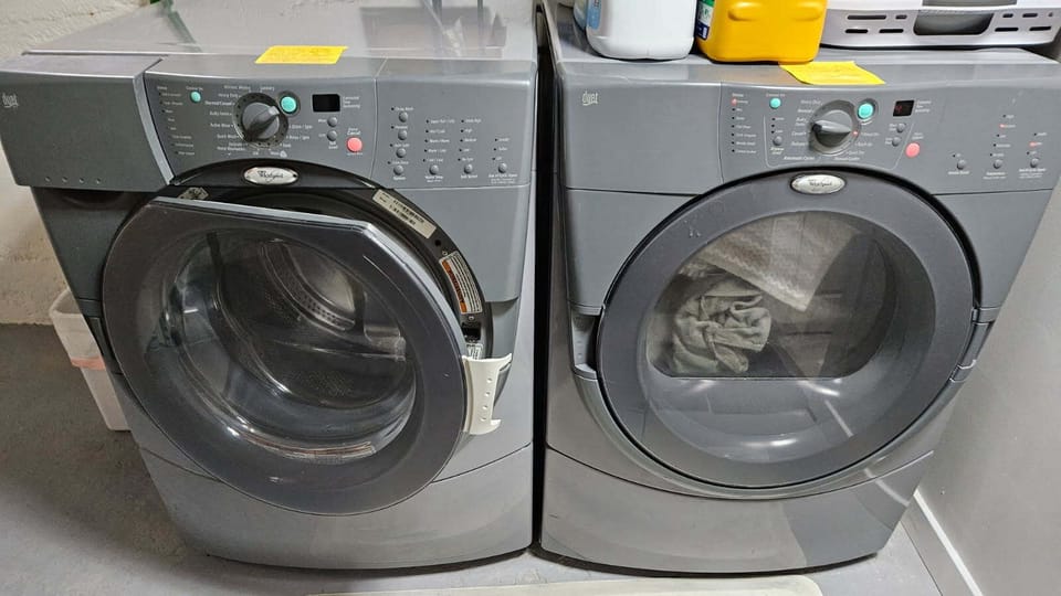 Full laundry with supplies in the basement.