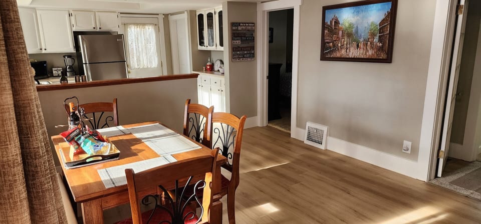 Quaint cottage w/ 2 bedrooms & bath upstairs. A bedroom, den & bath downstairs.