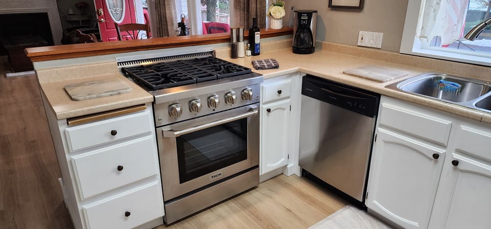 Kitchen has all the amenities and supplies you'll need. New Thor range too!