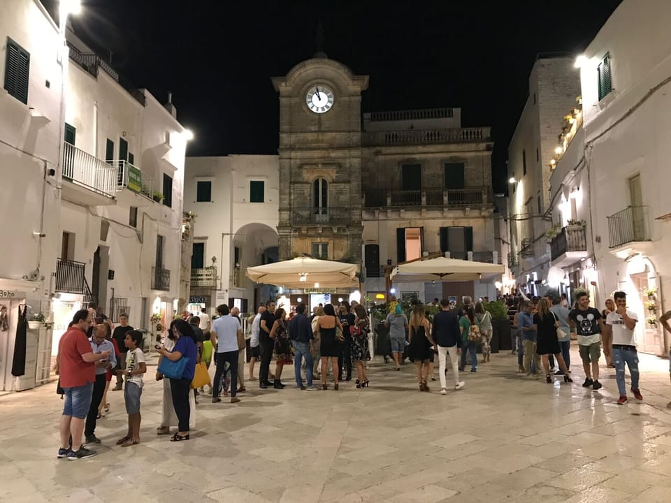 Enjoying a warm evening 'passeggiata' around Cisternino's Piazza, early August