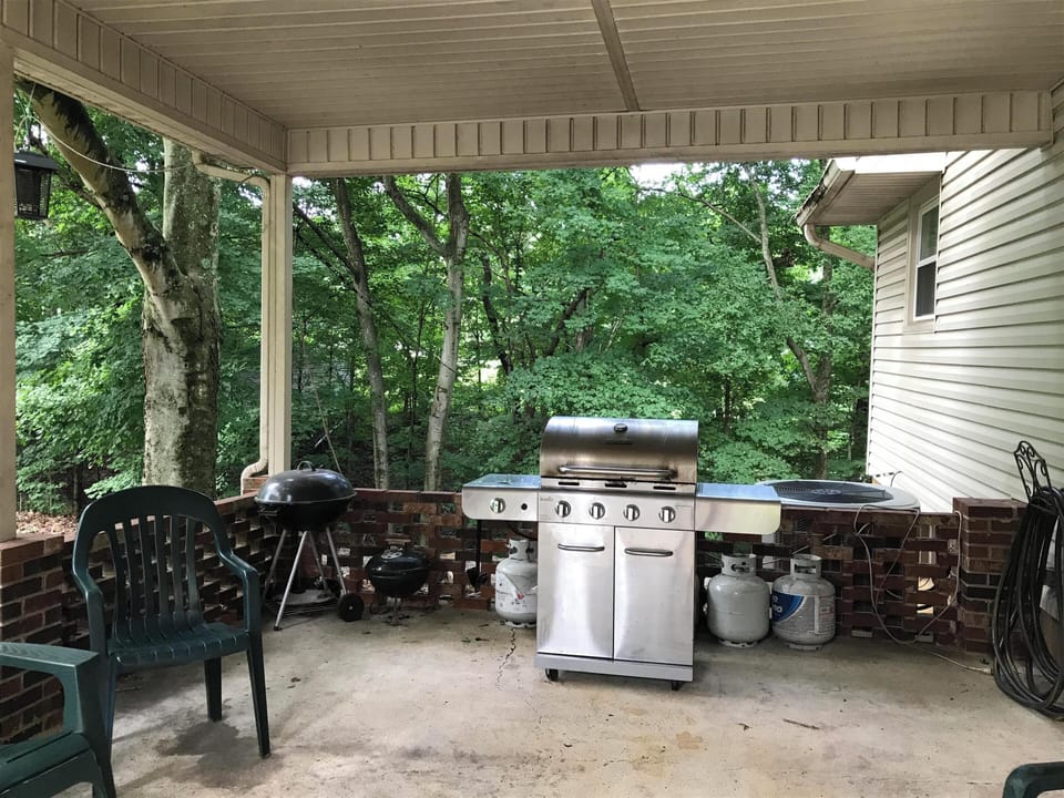 Grill is under the carport so cooking even when a rain shower comes through.
