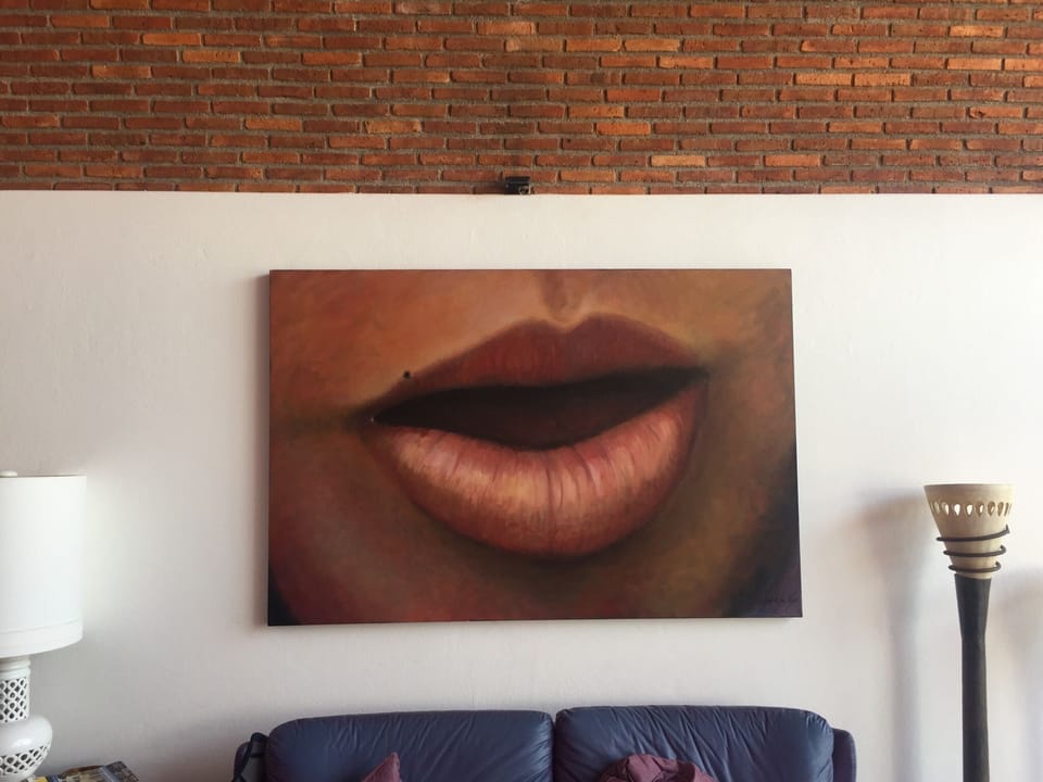 The Lips never lie.  Painting over sofa in top floor living area.