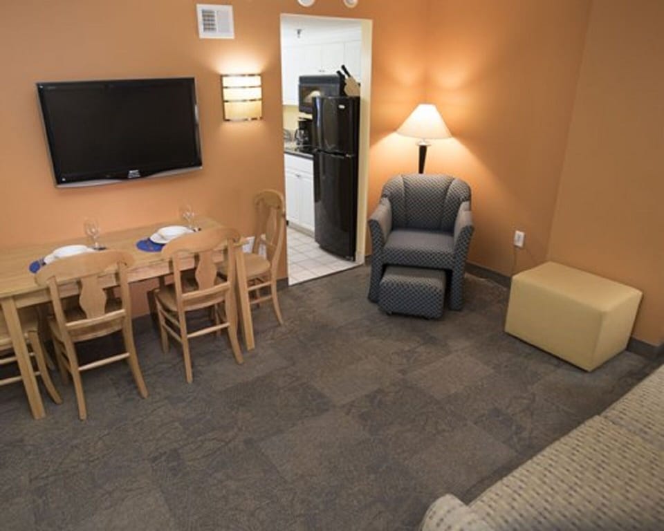 Living room/Dining area in each unit. Flat screen on the wall