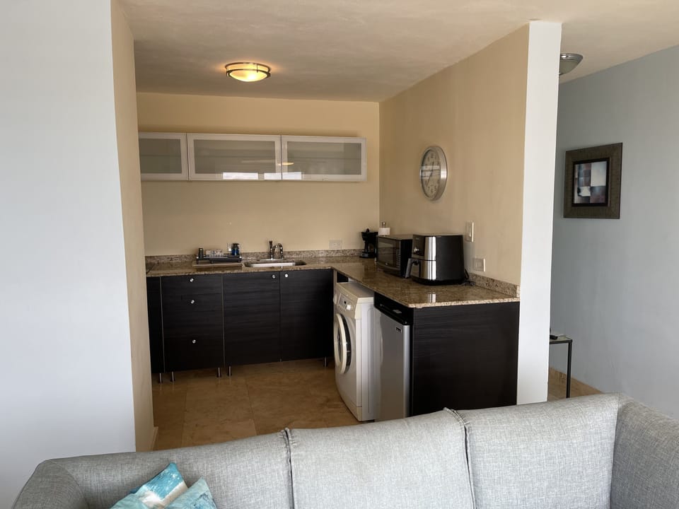 Kitchen with washing machine too! Drying racks in the closet! 