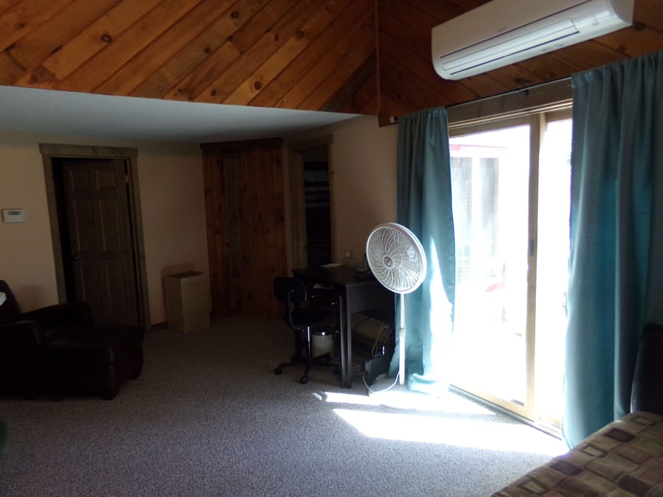 Work area by day bed and deck with chairs thru slider