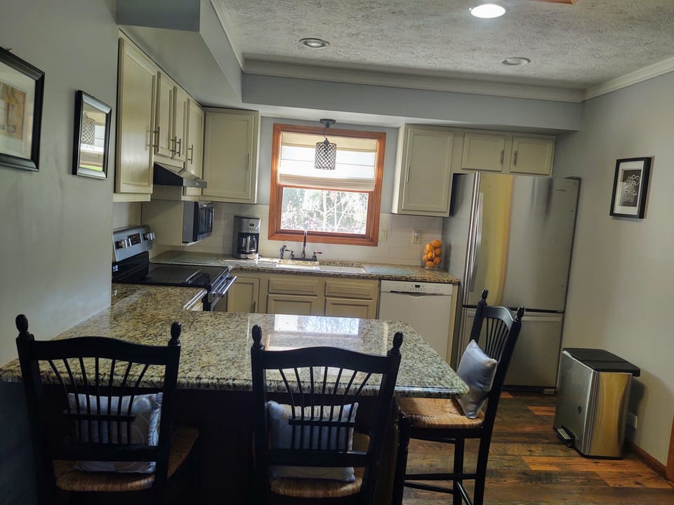 PLENTY OF DISHES, POTS, PANS, SLOW COOKER, ICE CREAM MAKER BLENDER, AND MORE. 