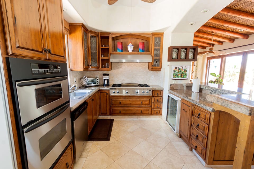Kitchen with top of the line appliances, wine fridge, and large walk in pantry.