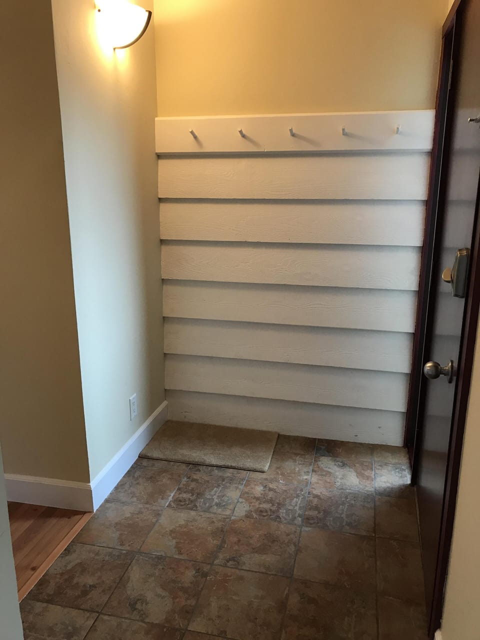 Foyer area inside condo for coats or use as ski rack