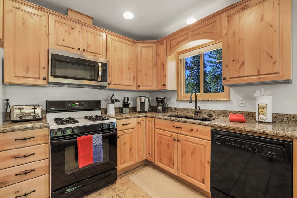 Let the tranquil views of nature inspire your cooking in this beautiful kitchen.