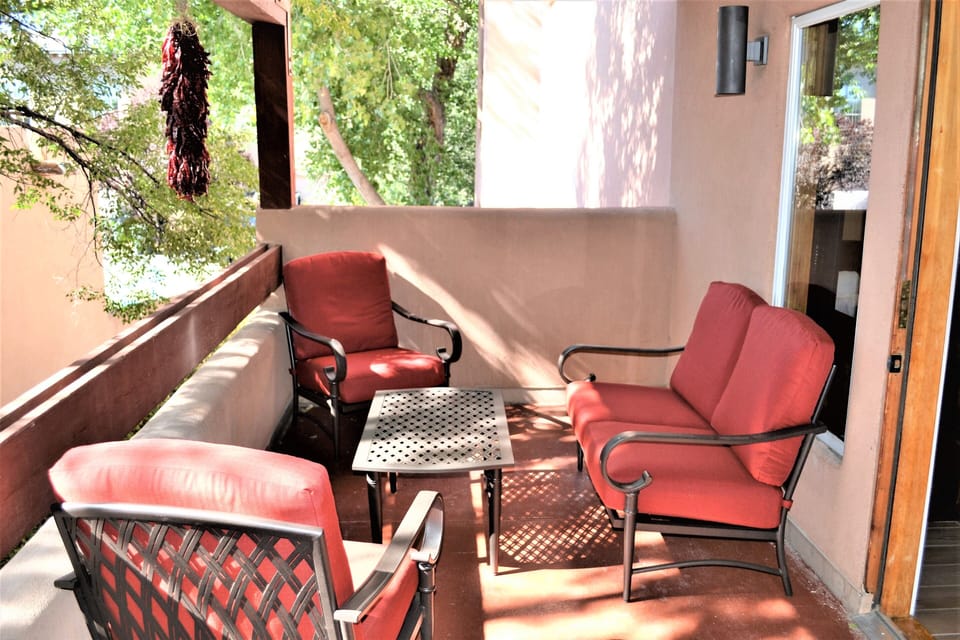 Balcony outside living room is covered and private