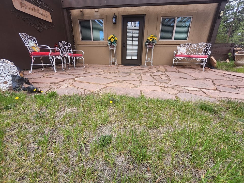 Private entrance & Patio area. Sensor lights light up entry way at night.