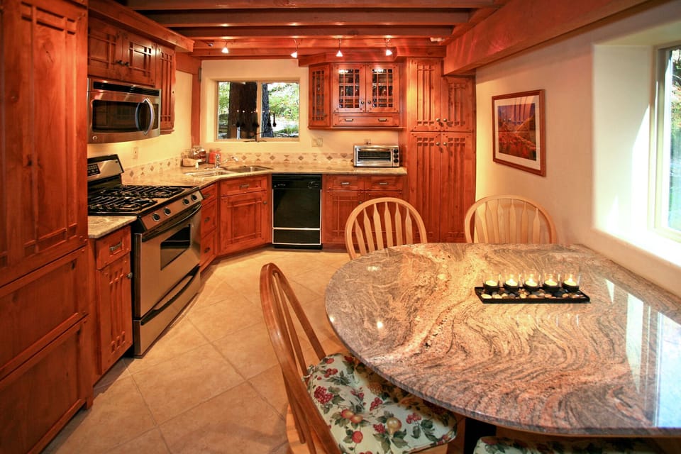 Gourmet kitchen w/SubZero fridge, Jenn-Air range, Craftsman cabinets, Euro light