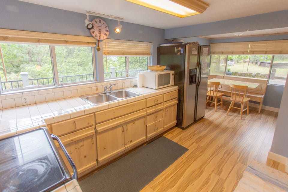 Sunny kitchen has views of the lake
