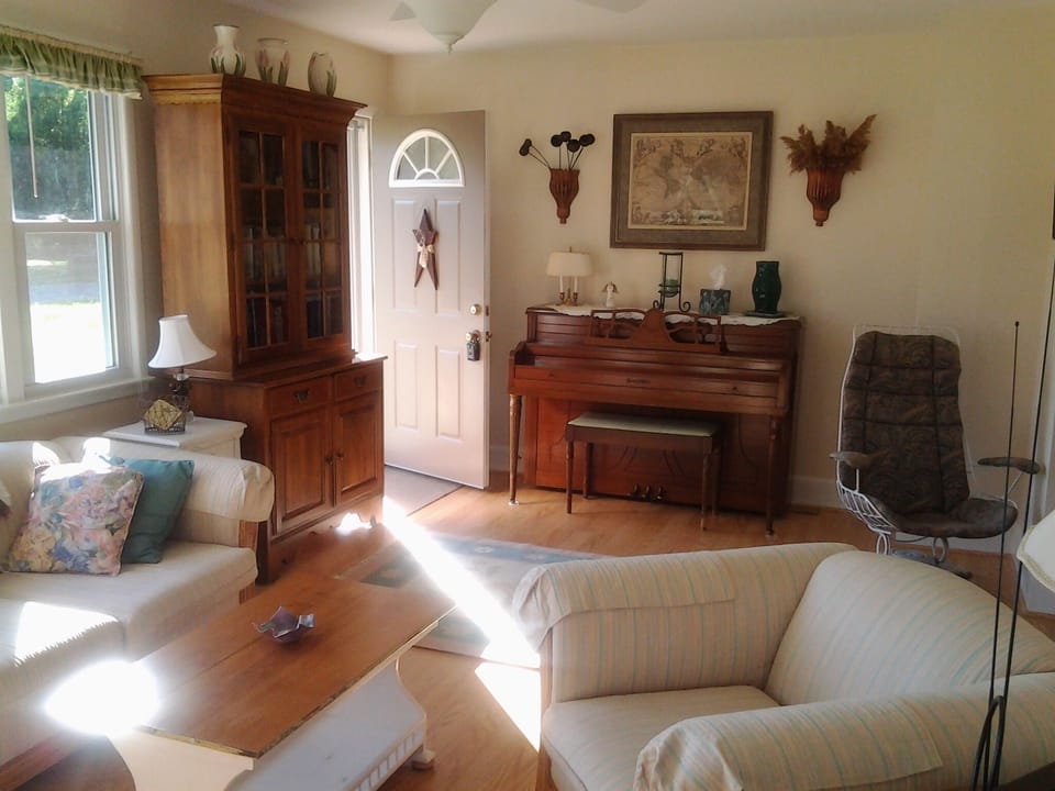 Front door entering into the Living Room; upright piano for your enjoyment!