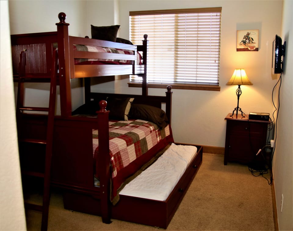 Bunk Room in lower level Twin over Full with twin trundle.  TV for movies only.