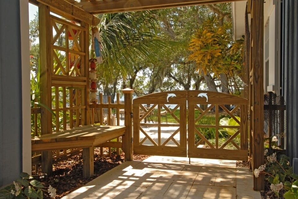 Dolphin Gate Leading to Pool & Dock From Courtyard