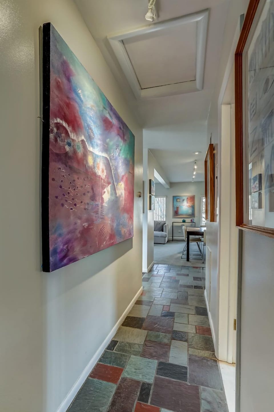 From the bedrooms in the back, bathroom is to the right and kitchen to the left