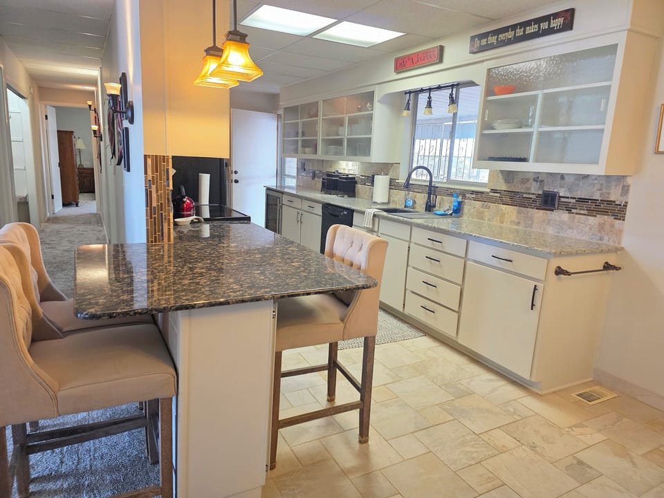 kitchen, coffee and or coffee maker, kitchen, oven, stovetop, dining table