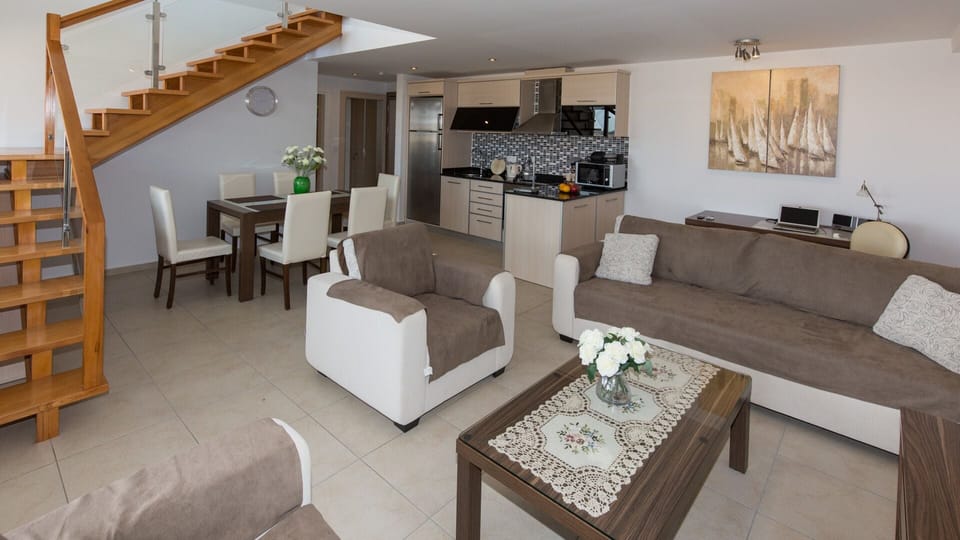 Spacious and comfortable sitting area with TV, satellite receiver and DVD